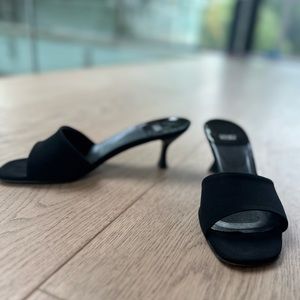 Black Stuart Weitzman sandal with kitten heel